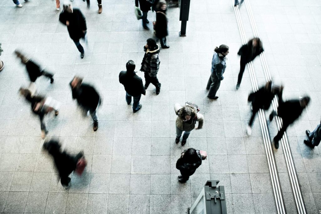 people walking on a tiled floor